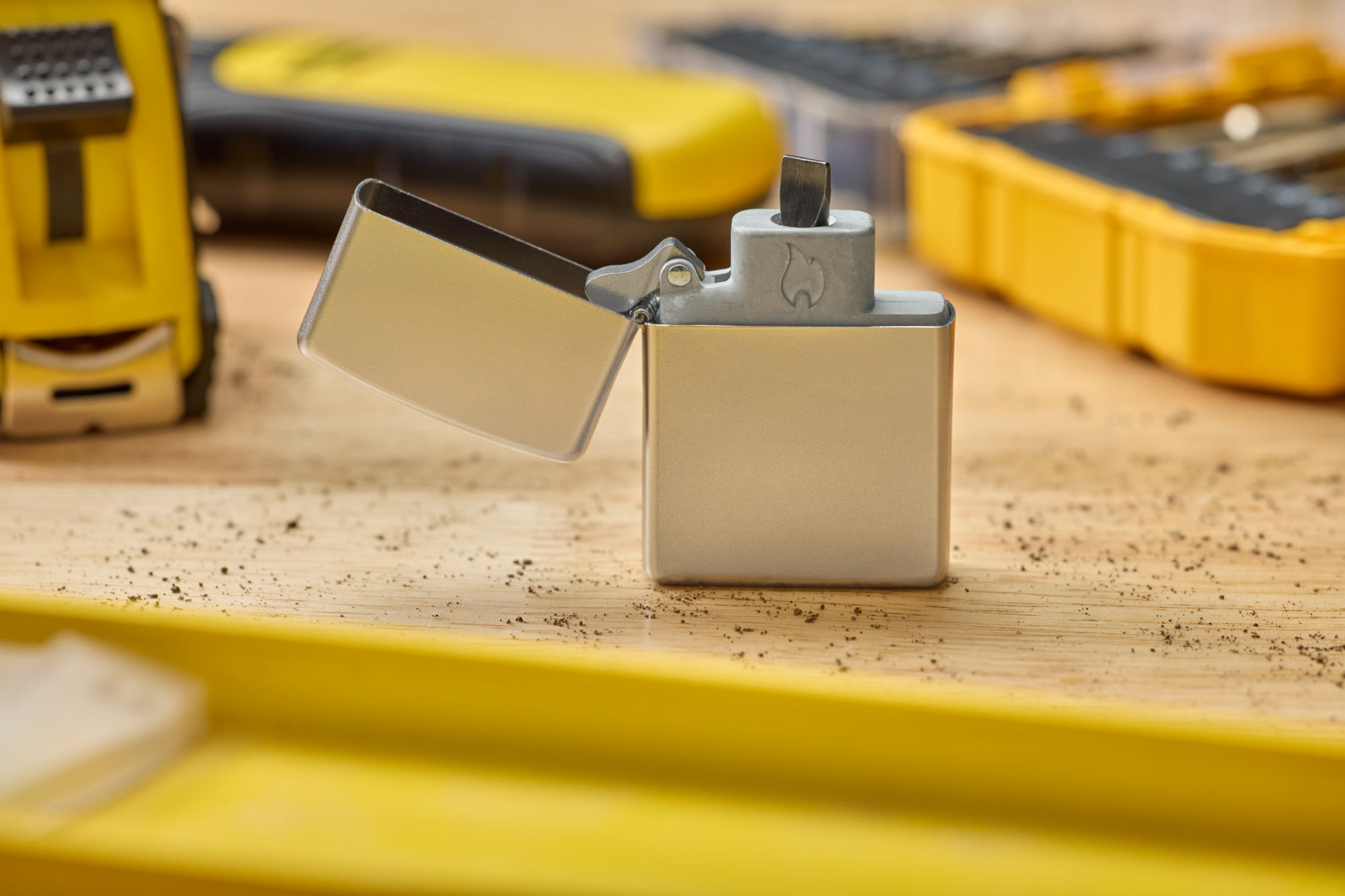 Lifestyle Image of Bit Safe sitting on worktable inside the Satin Chrome Case. 