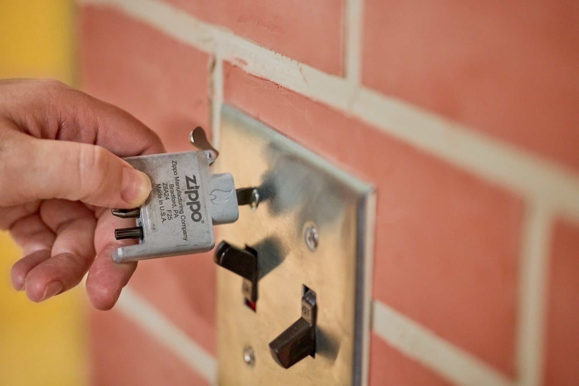 Lifestyle Image of the Bit Safe Screwdriver USA being used to fix a light fixture. 