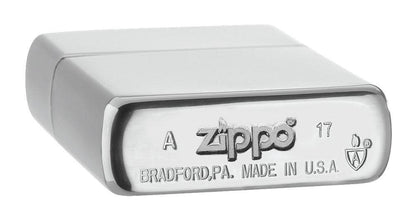ArmorÂ® Brushed Chrome Windproof Lighter laying flat, showing the bottom stamp