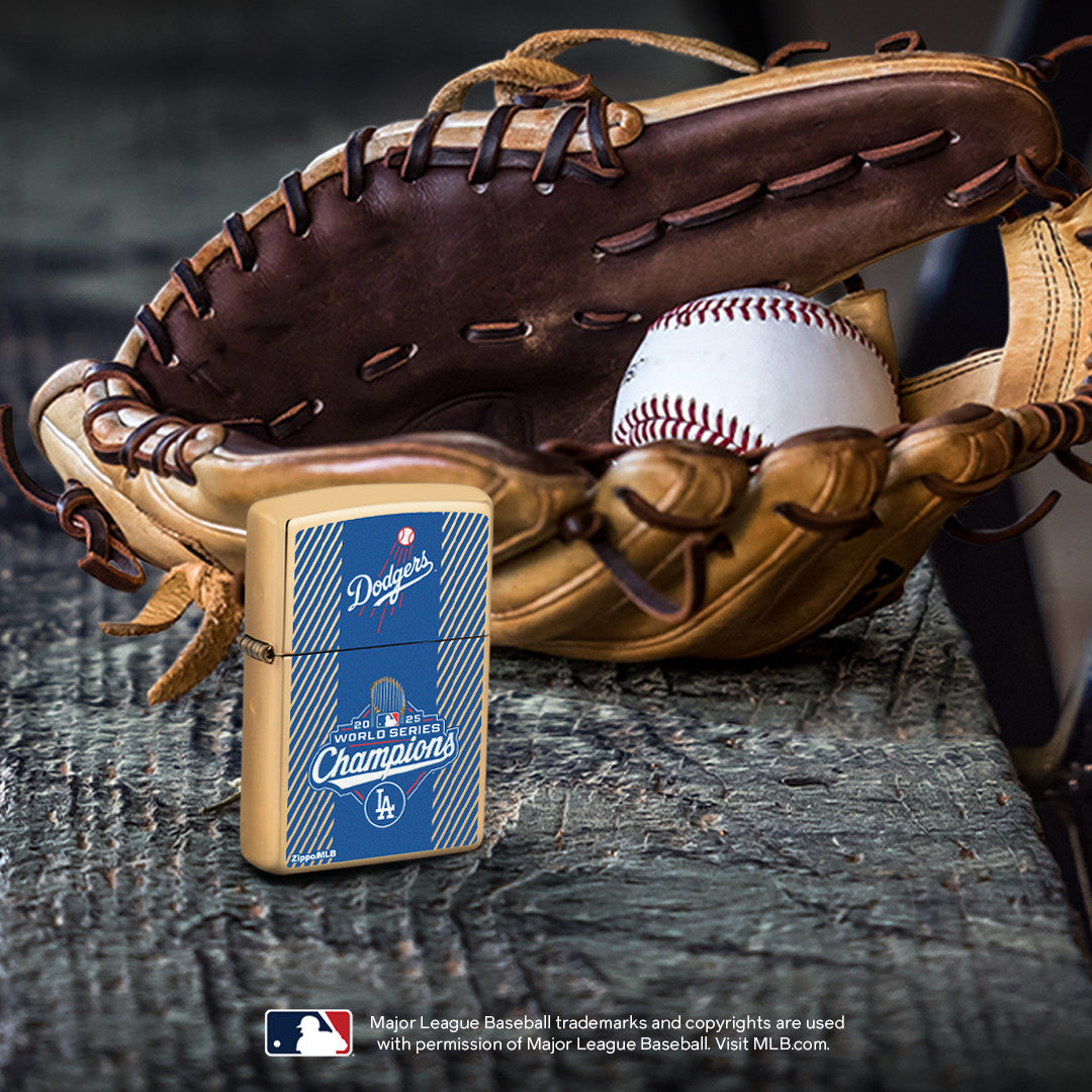 Lifestyle image of 2025 World Series™ Champions - Los Angeles Dodgers™ Commemorative Lighter standing on a wooden bench in front of a baseball glove with a ball resting inside the glove.