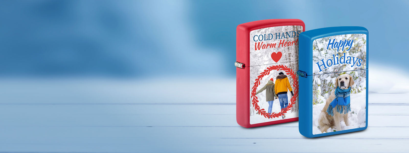 Two holiday-themed lighters on a blue background