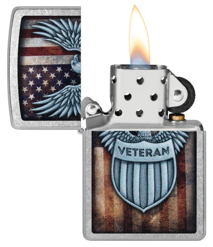 Zippo Veteran Crest Design Street Chrome Windproof Lighter with its lid open and lit.