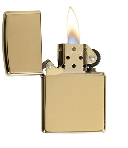 ArmorÂ® High Polish Brass Windproof Lighter with its lid open and lit