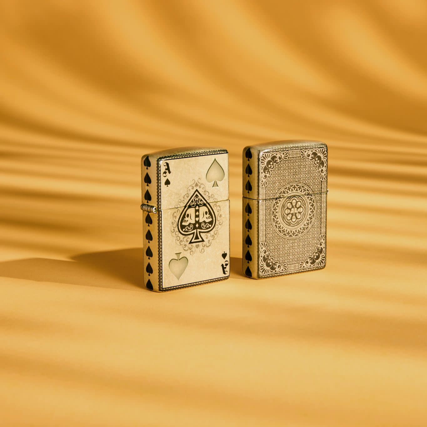 Lifestyle image of Zippo Ace of Skulls Design 540 Tumbled Brass Windproof Lighter