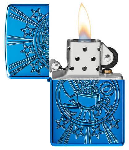 Zippo Starburst Design Armor® High Polish Blue Windproof Lighter with its lid open and lit.
