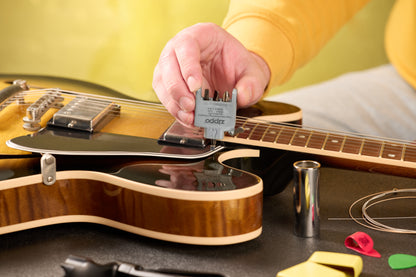 Lifestyle Image of the Bit Safe Screwdriver USA being used on a guitar.