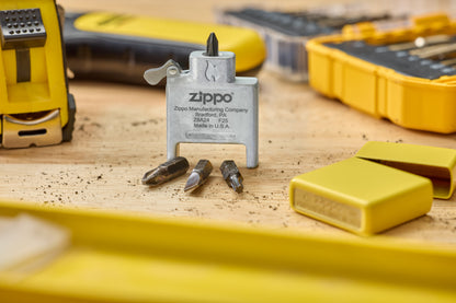 Lifestyle Image of Bit Safe Screwdriver USA standing on wood worktable with sunflower case and tools in the background.
